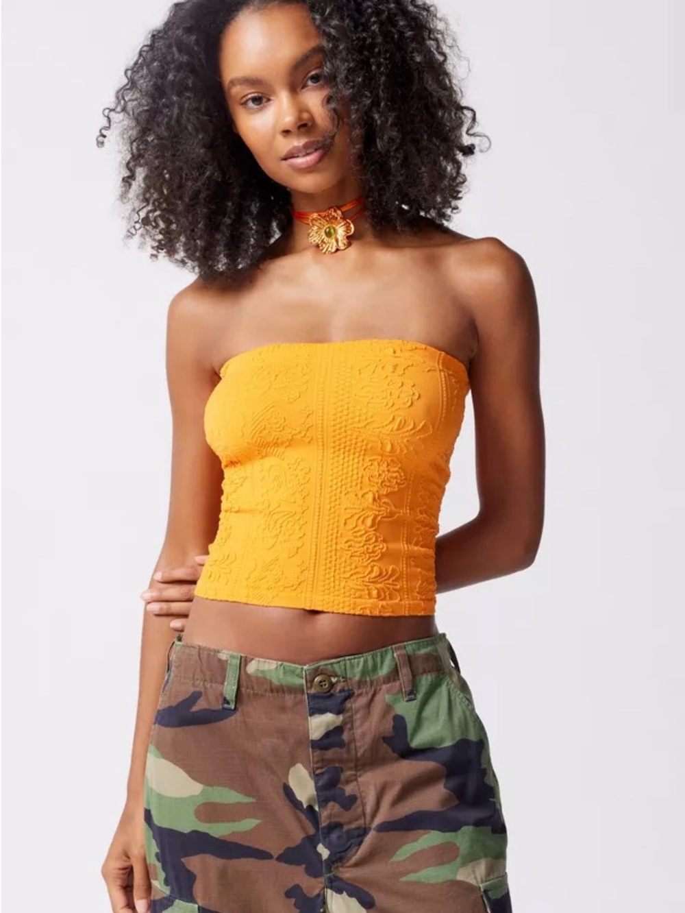 Urban Outfitters out from under orange tube top